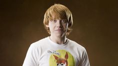 a young man with red hair wearing a t - shirt that has an image of a fox on it