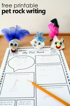 three little birds sitting on top of a table next to a paper with writing and pencils