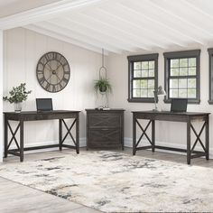 a living room filled with furniture and a clock on the wall