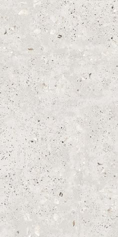 a white marble textured surface with small speckles