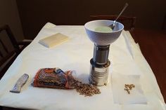 a table topped with a bowl filled with cereal