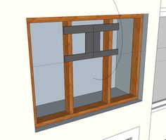 an unfinished window frame is shown with the top section cut out and ready to be installed