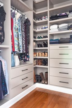 a walk in closet filled with lots of drawers and clothes on top of shelves next to a hard wood floor