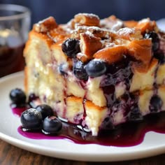 a piece of blueberry cheesecake on a white plate