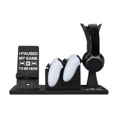 a couple of white objects sitting on top of a black stand