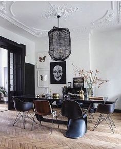 the dining room is decorated in black and white