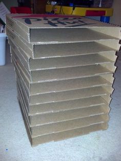 a stack of cardboard boxes sitting on top of a table