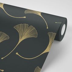 a black and gold wallpaper with leaves on it