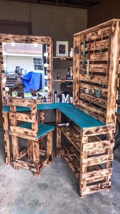 two wooden desks made out of pallet wood with mirrors on the top and bottom