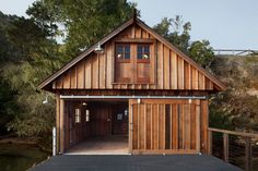 a large wooden building sitting in the middle of a forest