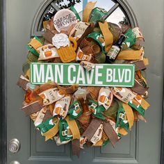 a man cave wreath on the front door