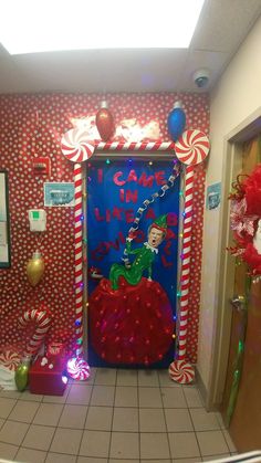 a door decorated with candy canes and decorations