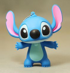 a little blue toy with pink ears and eyes