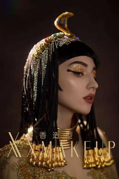 a mannequin wearing gold jewelry and headdress with the words make up on it