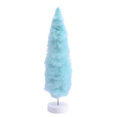 a blue fake tree on a white stand