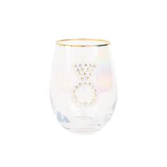 a wine glass with the letter b on it's side and gold rimmed