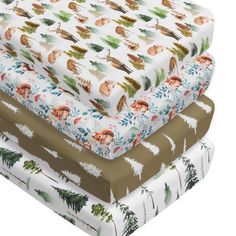 three sheets are stacked on top of each other in different patterns and sizes, including pine trees