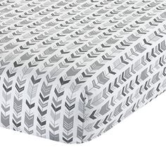 an image of a white and grey bed sheet with arrows on the bottom half of it