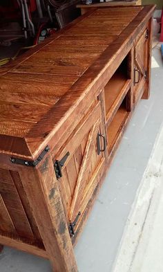 a large wooden cabinet sitting on top of a floor