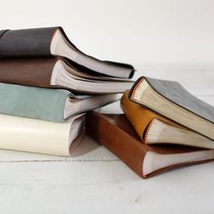 a stack of books sitting on top of each other