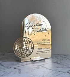 an award is placed on a marble surface with the words signature coutiful written in cursive writing