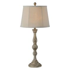 a table lamp with a white shade on it