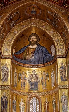 the inside of an ornate church with gold paint and paintings on it's walls