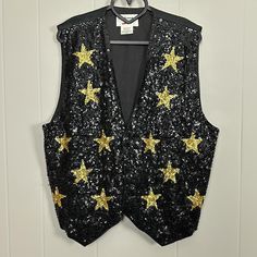 Black and gold star sequin vest by Fashion fantasy. It’s in good condition. Got a bit of weight to it. Cotton/rayon/sequin/beads

Length 23”
Bust 42”

Item# D0044 Sequin Vest, Fashion Fantasy, Sequin Beading, Gold Star, Fantasy Fashion, Gold Stars, Women's Vest, Womens Vest, Black And Gold