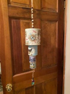 a lamp hanging from the side of a wooden door