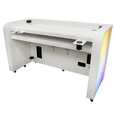 a white computer desk with a rainbow light on the top and bottom section, in front of a white background