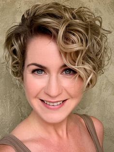 Asymmetrical short curly haircut with bold angles and natural curls Curly Hairstyle Ideas, Curly Cut