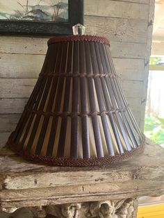 a lamp shade sitting on top of a wooden table