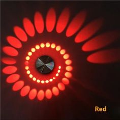 an image of a red light in the dark with circles on it's side