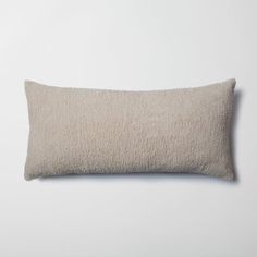 a white pillow on a white wall