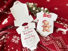 baby shower gift tags on red fabric with white snowflakes and christmas tree decorations