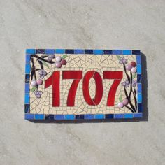 a tile sign with the number 707 on it