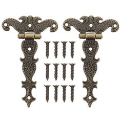 four antique style door handles with screws on each side and one has an ornate design