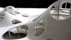 the model is made to look like it could be constructed from white paper and plastic