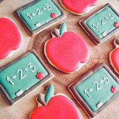 decorated cookies with numbers and apples on them