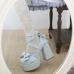 Elevate your style with our Blue Kawaii Lolita Bow Star Chunky Platform High Block Heels. Crafted from glossy blue patent leather, these statement heels feature charming bow details at the front and back, complemented by a star-shaped metal buckle. The high block heel and chunky platform offer both height and comfort, making them perfect for coquette, kawaii, Lolita, or pastel fashion enthusiasts. Glossy blue patent leather for a vibrant, luxurious look Bow details at the front and back for added charm Star-shaped metal buckle for a playful touch High block heel and chunky platform for height and comfort Ideal for coquette, kawaii, Lolita, and pastel aesthetics Harajuku Style Heels For Summer Parties, Summer Harajuku High Heels, Harajuku High Heels For Summer, Kawaii Platform Heels With Round Toe, Cute Bow Heels With Round Toe, Harajuku Ankle Strap Heels For Party, Cute Heels With Bow And Round Toe, Cute Closed Toe Heels With Bow, Cute Round Toe Heels With Bow