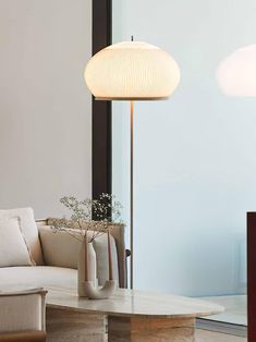 a living room scene with focus on the couch and coffee table in the foreground