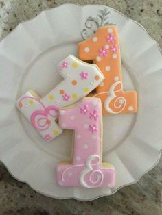 a white plate topped with cookies shaped like numbers