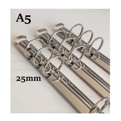 four stainless steel pipe holders are shown with the measurements for each one in this image