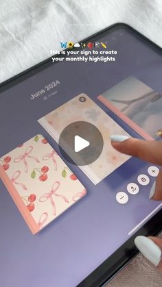 a person using a cell phone to play with greeting cards on the screen, while another hand is pointing at them