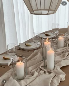 a table with candles and plates on it