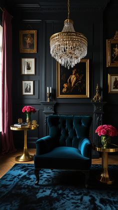 a living room with black walls, blue velvet couches and paintings on the wall