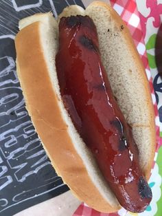 a hot dog on a bun with ketchup and mustard