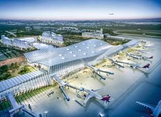 an artist's rendering of the airport with planes parked in front and around it