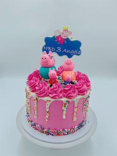 a pepo pig birthday cake with pink frosting and sprinkles on top