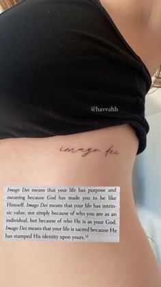 the back of a woman's stomach with a piece of paper taped to it